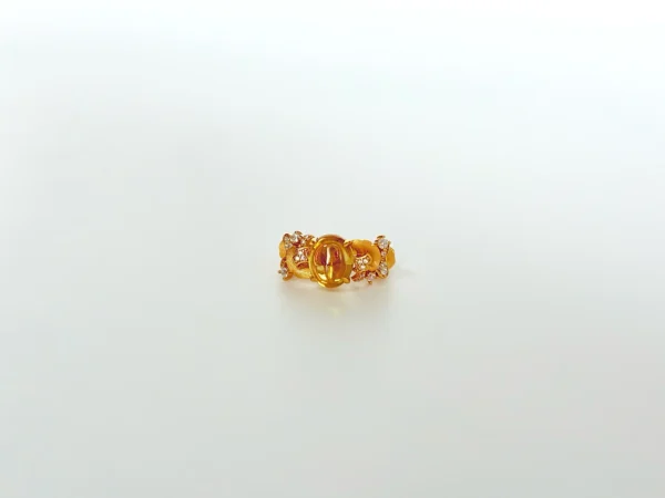 Top view of elegant gold rings for women: 18k gold plated sterling silver gemstone ring showcasing a golden-yellow 5A cubic zirconia stone surrounded by brilliant simulated diamond clusters.